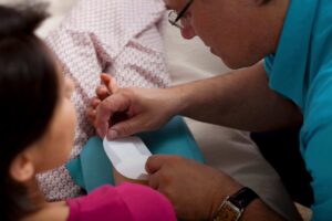 nurse caring for patient’s wound