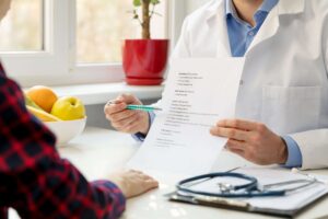 wound care specialist explaining a meal plan to patient