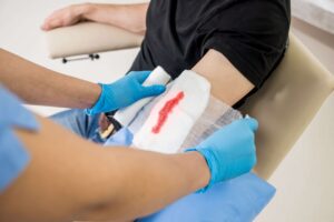 specialist treating a traumatic wound