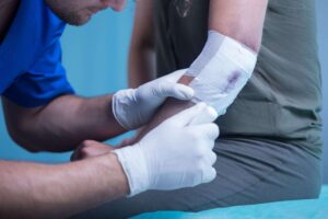 doctor dressing a wound