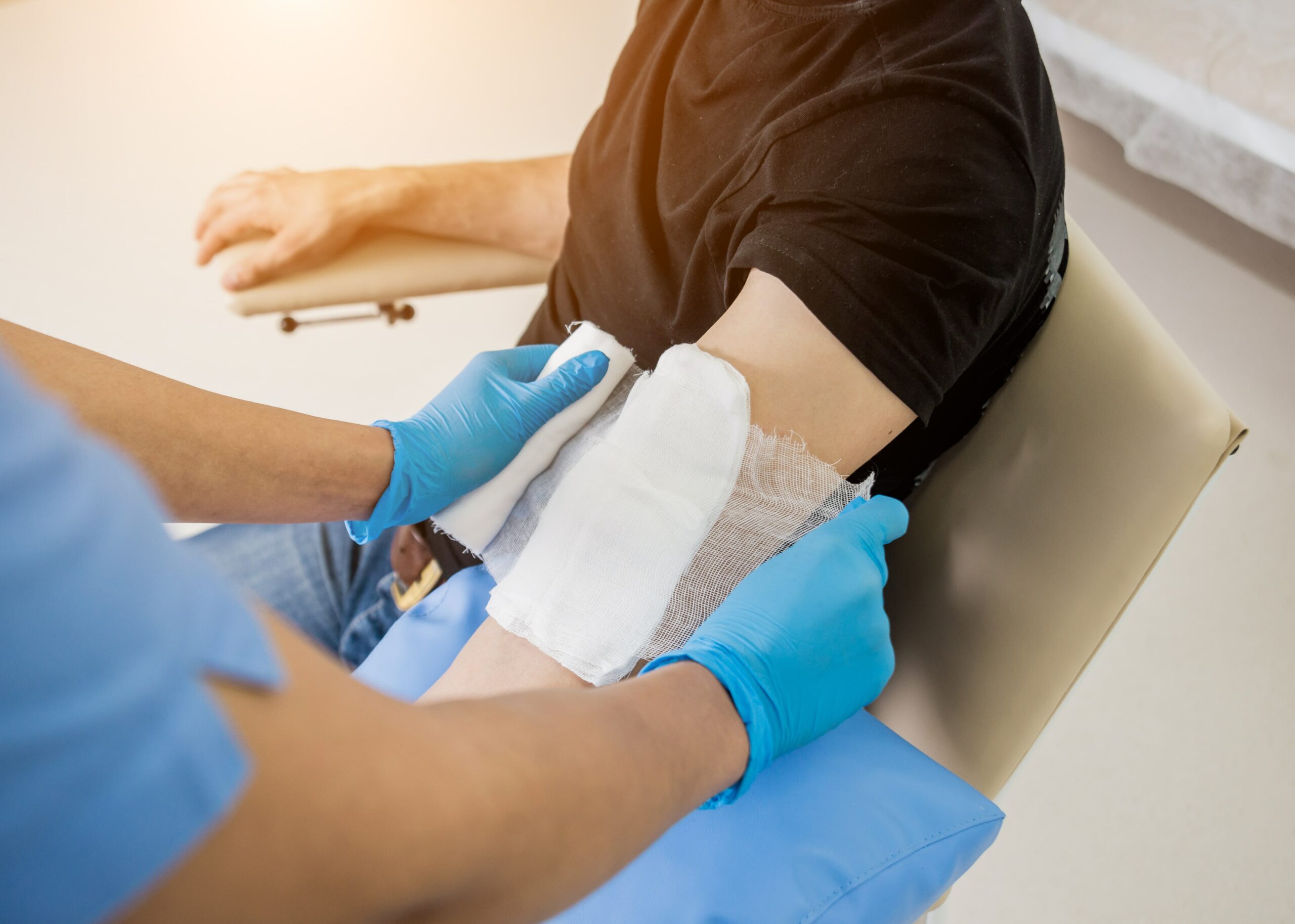 specialist adding a bandage to a burn wound